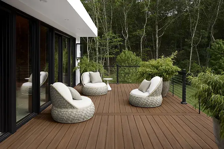 Mahogany colored deck with sleek black railing featuring a horizontal cable rail infill
