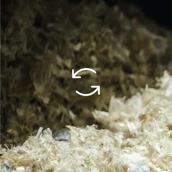 A pile of shredded paper with a cyclical icon prominently displayed on top.