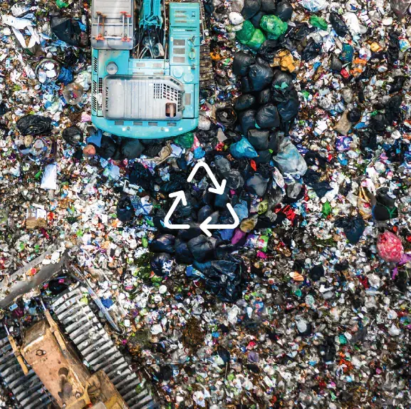 A pile of shredded paper with a cyclical icon prominently displayed on top.