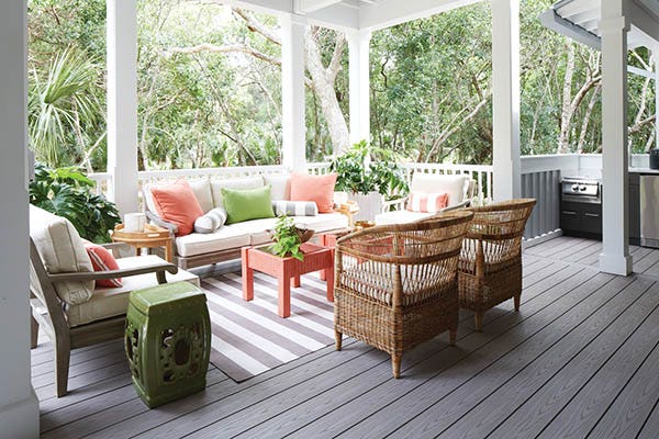 A covered composite deck with outdoor living room furniture