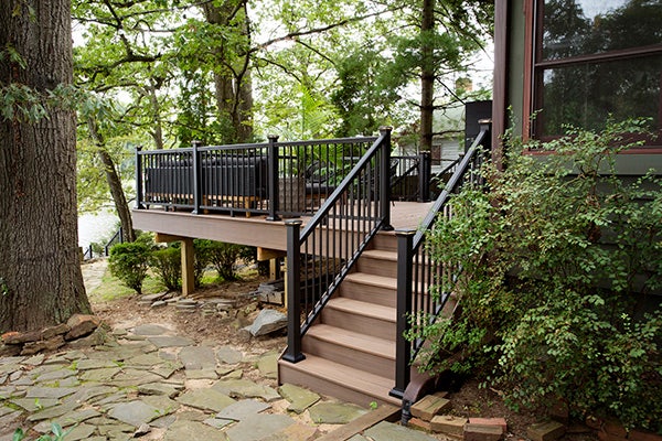 Backyard inspiration featuring multi-level deck made from TimberTech AZEK Vintage Collection decking in English Walnut