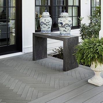 Backyard Porch with herringbone pattern made from TimberTech AZEK Vintage Collection decking in Coastline