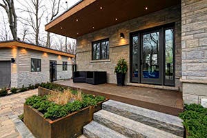 Decking featuring TimberTech PRO Legacy Collection Mocha with two outdoor chairs