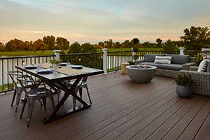 Deck Featuring TimberTech PRO Reserve Collection in Dark Roast with dining and living area