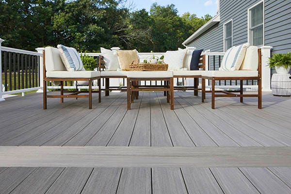 Coastal style gray composite deck with AZEK cortex screws for a fastener-free surface