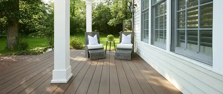 Two chairs on a mahogany colored deck