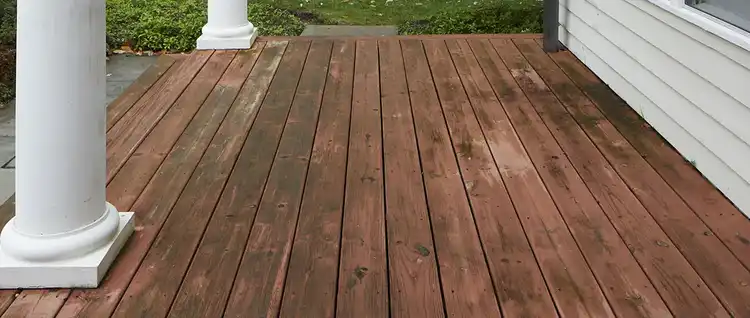 Wooden deck with heavy staining and discoloration