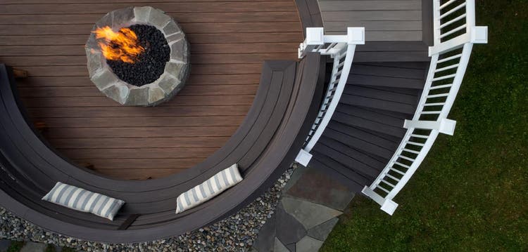 Custom-built spiral stairs on a composite deck