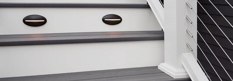 Close-up of composite deck stairs with riser lights