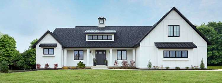 Modern farmhouse-style front porch design ideas featuring a stark black and white home