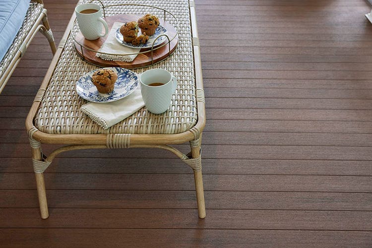 Traditional-style front porch designs feature Mahogany capped polymer porch boards