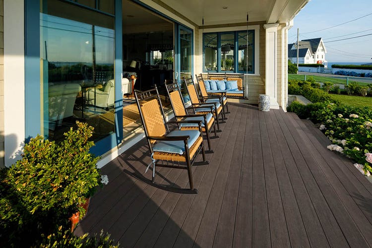 Coastal-style front porch designs feature cool blue colors and natural textures