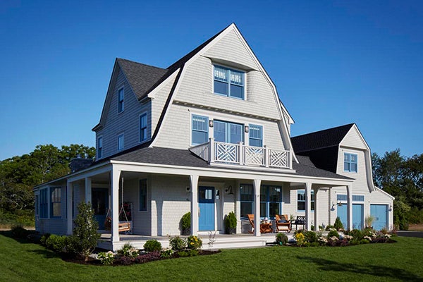 TimberTech AZEK Trim and Slate Gray Porch on farmhouse-style home