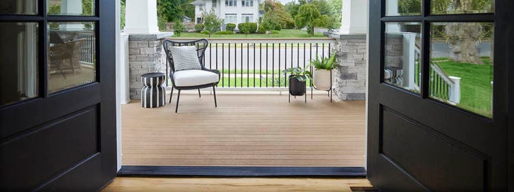 An inviting porch featuring modern front porch ideas like interior-inspired decor