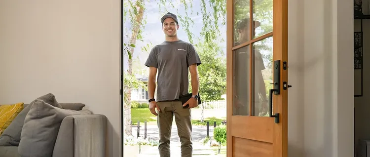 TimberTech contractor in doorway of home
