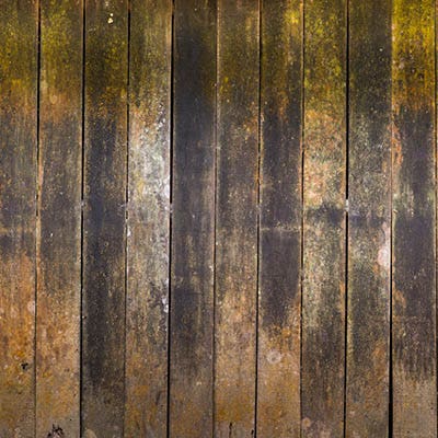 Deck damage can be seen on a wood deck's surface