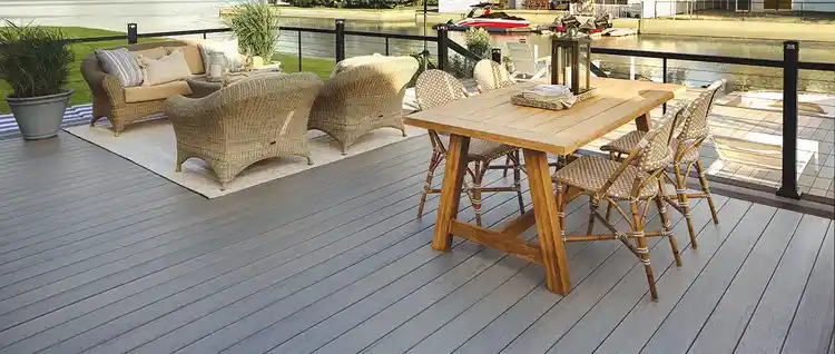 A TimberTech Composite Deck from the Legacy Collection in the color Ashwood. TimberTech Railing is also featured with cable infill.