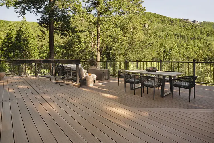 Angled view of Tiffani's deck with a forest in the background