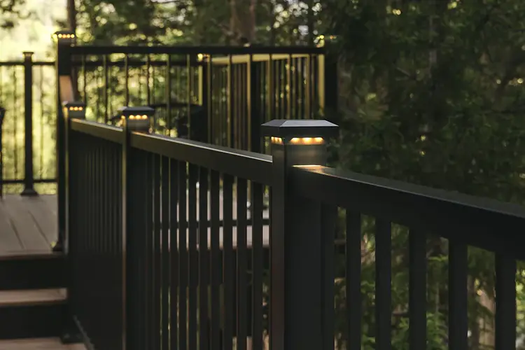 Impression rail express railing puts the finishing touch on Tiffani's deck, post cap lights glow on the top of each post