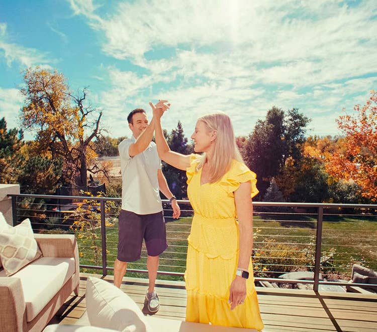 Jason and Kelly high-five on their new deck