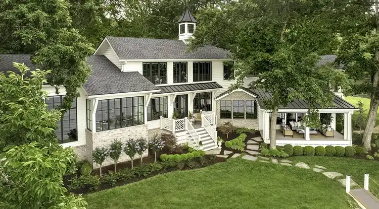 Large white Southern home with a large covered patio extending off the house