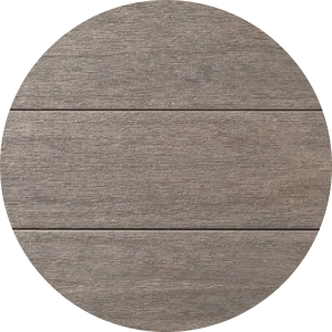 A close up of Coastline decking, medium gray decking with warm tan and charcoal undertones. This color is from our Advanced PVC Porch Collection.