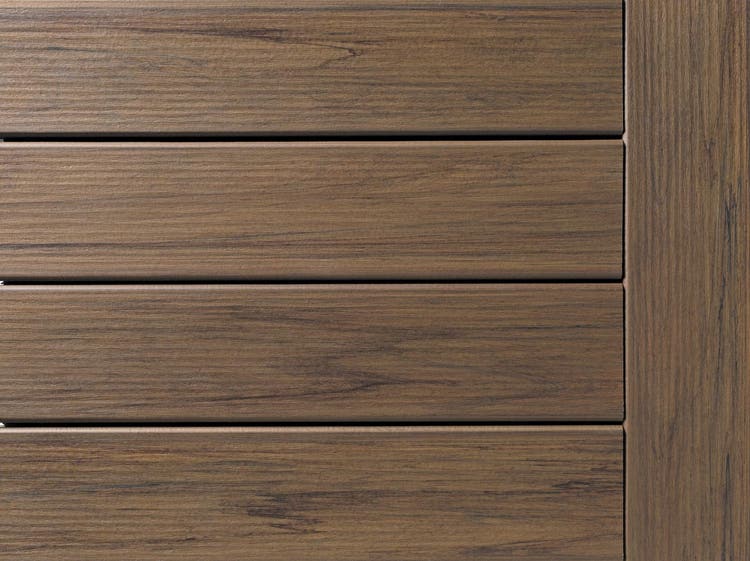 A close view of the Pecan decking from the Composite Decking Legacy Collection.
