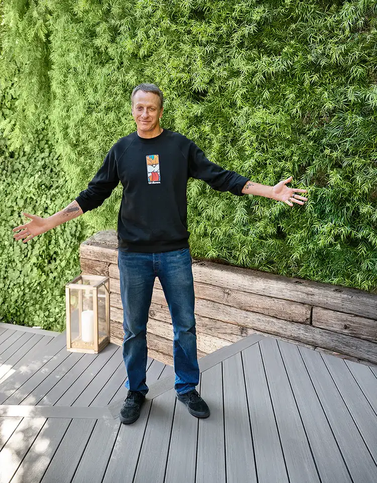 Tony stands with his arms outstretched as if to welcome you to his deck.