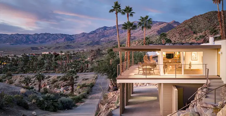 Trina's home on a mountainside at sunset