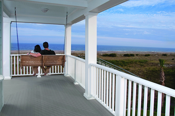Front porch designs featuring white composite Reserve Rail and TimberTech Porch boards in Slate Gray