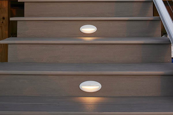 Outdoor deck lighting ideas with white stair risers