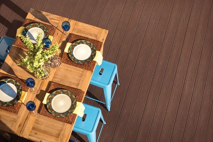 ttedge-darkteak-167-cmyk_opt An overhead view of TimberTech EDGE Premier Collection Premier Dark Teak deck with dining table