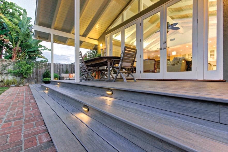 Backyard deck featuring TimberTech PRO Legacy in Ashwood with Riser Lights