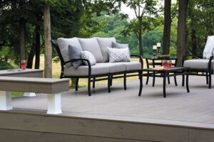 Deck inspiration featuring TimberTech PRO in Terrain Silver Maple with outdoor chairs
