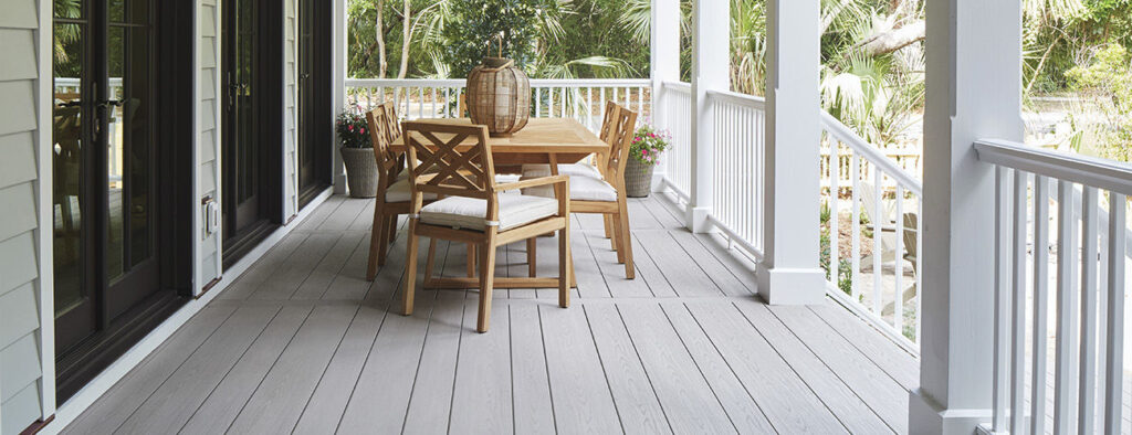 TimberTech AZEK Harvest in Slate Gray Premier Rail Wide Composite Decking Boards Header and dinning area