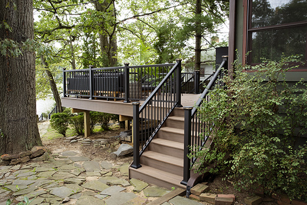 Backyard inspiration featuring multi-level deck made from TimberTech AZEK Vintage Collection decking in English Walnut