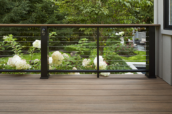 Mid-century modern railing featuring TimberTech Classic Composite Series Drink Rail & Cable Infill