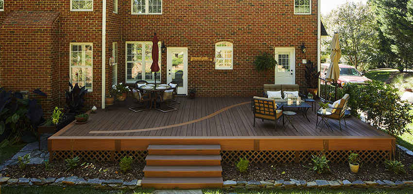 Outdoor living space plans for traditional-style home featuring TimberTech AZEK Vintage Collection in Mahogany and Cypress