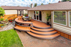 TimberTech-AZEK-Vintage-Collection-Cypress-Dark-Hickory-Premier-Rail-Black Curved staircase featuring TimberTech AZEK Vintage Collection