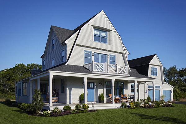 TimberTech AZEK Trim and Slate Gray Porch on farmhouse-style home