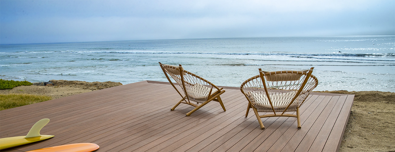 Standing water on composite deck boards insight featuring TimberTech AZEK Vintage Collection Mahogany deck