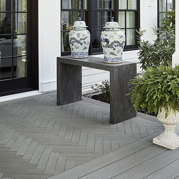 Backyard Porch with herringbone pattern made from TimberTech AZEK Vintage Collection decking in Coastline