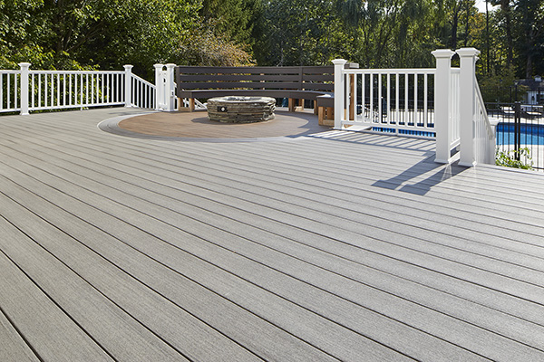 Best-Composite-Decking-For-Full-Sun-TimberTech-AZEK-Vintage-Collection-Coastline-Mahogany-Dark-Hickory-Curved-Deck-Design