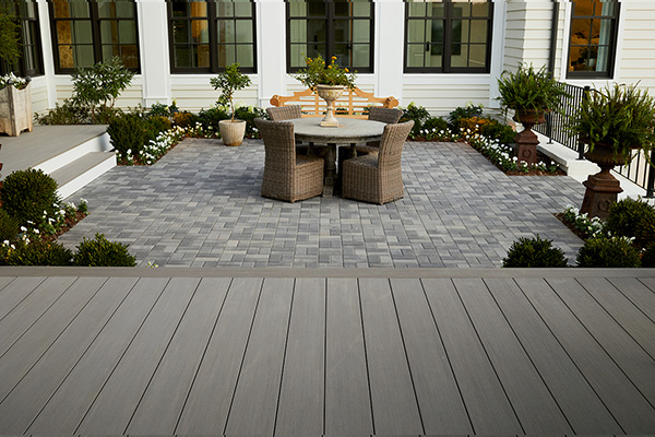 Mixed-material backyard with TimberTech Porch boards in Coastline