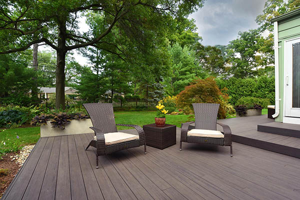 deck featuring TimberTech PRO Legacy Collection Espresso in with two outdoor chairs