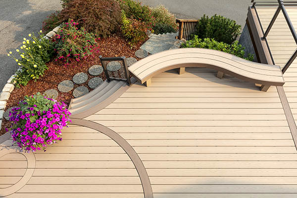 Creative Deck Ideas featuring TimberTech AZEK Harvest Collection in Brownstone with bright pink potted flowers