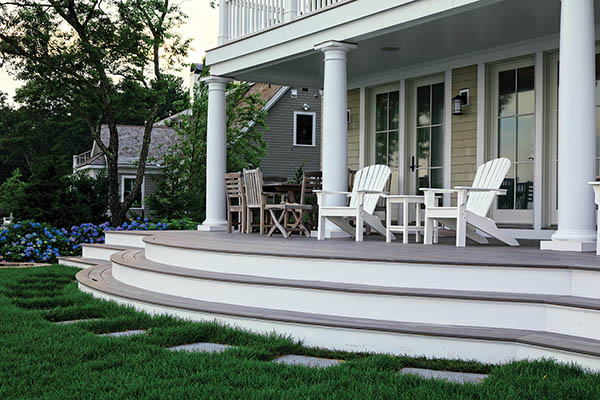 Creative Deck Ideas featuring Timbertech PRO Legacy Collection in Ashwood with white adirondack chairs