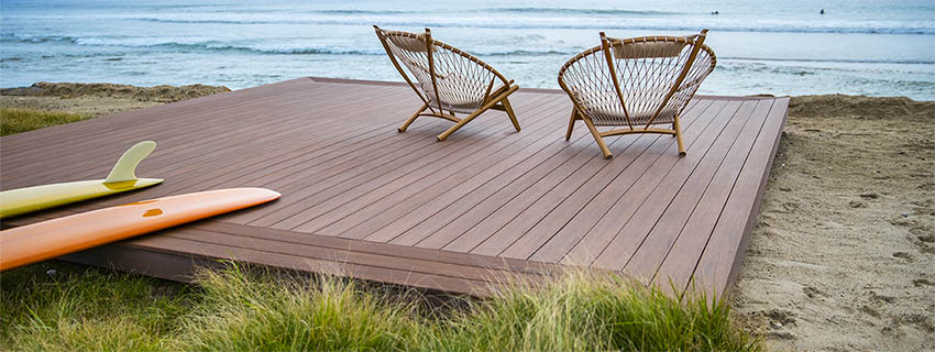 How to be more sustainable featuring TimberTech AZEK Vintage Collection in Mohagany deck on beach