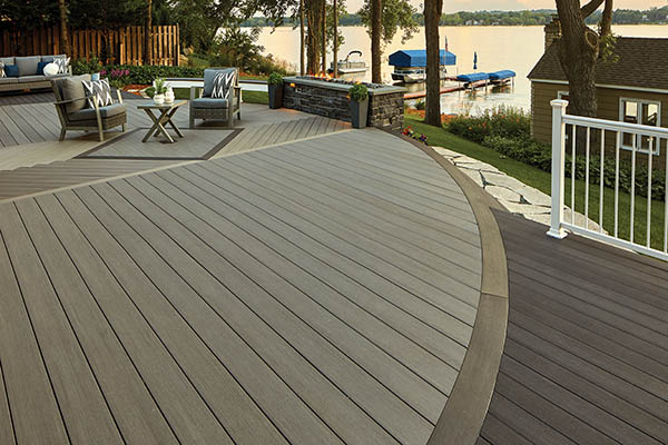 deck ideas featuring TimberTech AZEK Vintage Collection in Dark Hickory Coastline accents lakeside home