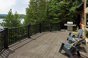 Second-story deck in the sun made from TimberTech AZEK Vintage Collection Dark Hickory